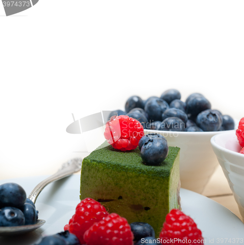 Image of green tea matcha mousse cake with berries