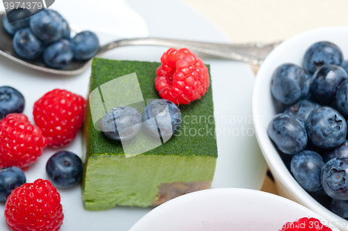 Image of green tea matcha mousse cake with berries