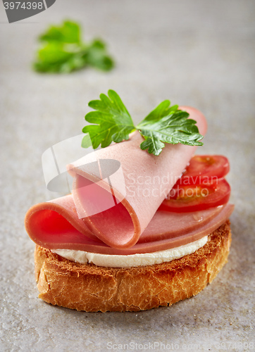 Image of toasted bread with sausage slices