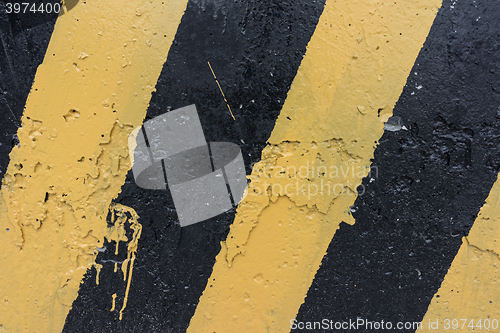 Image of Yellow and black concrete barrier