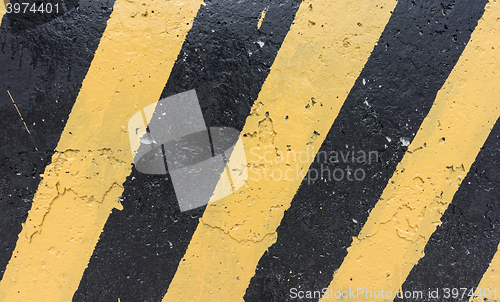 Image of Yellow and black concrete barrier