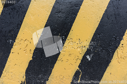 Image of Yellow and black concrete barrier