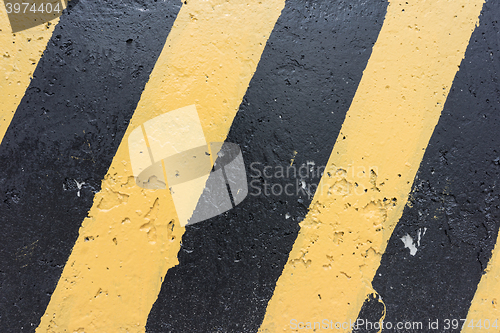 Image of Yellow and black concrete barrier