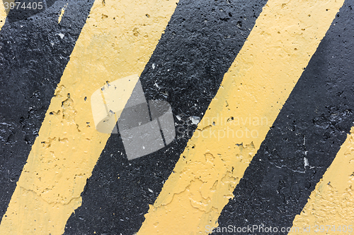 Image of Yellow and black concrete barrier