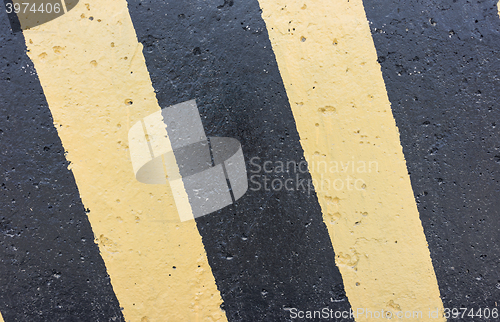 Image of Yellow and black concrete barrier