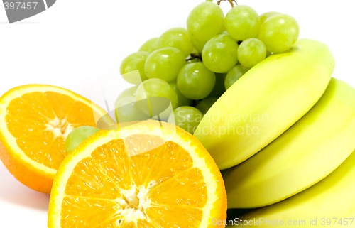 Image of grapes, bananas and two halves of orange