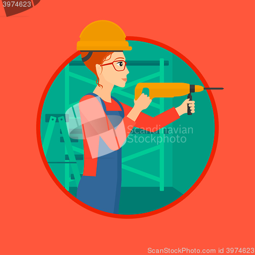 Image of Worker with hammer drill.