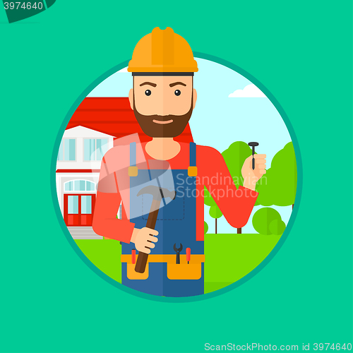 Image of Cheerful builder with hammer.