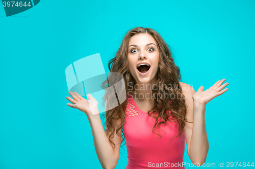 Image of Portrait of young woman with shocked facial expression