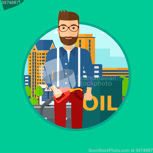 Image of Man with oil barrel and gas pump nozzle.