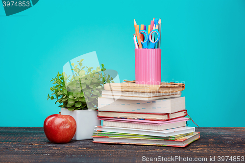 Image of Back to School concept. Books, colored pencils and apple