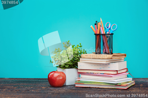 Image of Back to School concept. Books, colored pencils and apple