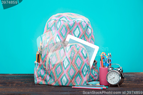 Image of Back to School concept. Books, colored pencils and backpack