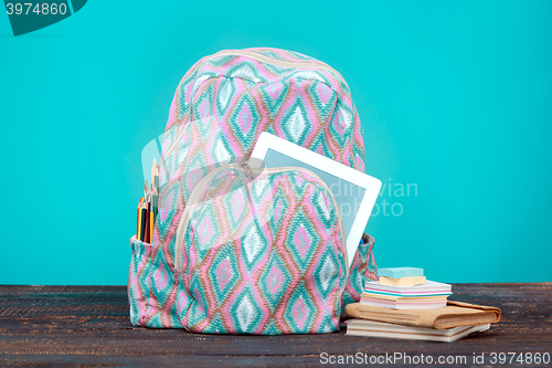 Image of Back to School concept. Books, colored pencils and backpack