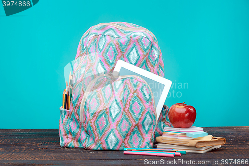 Image of Back to School concept. Books, colored pencils and backpack