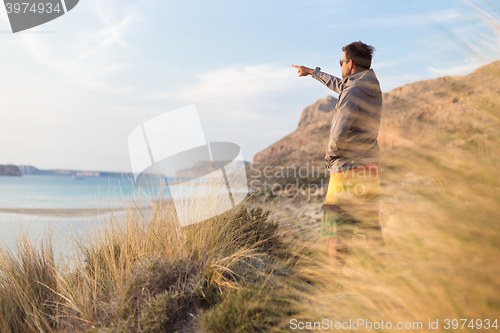 Image of Free active man enjoying beauty of nature.