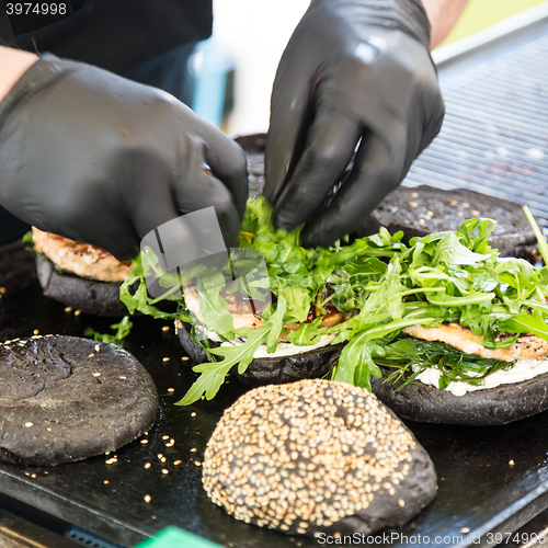 Image of Beef burgers ready to serve on food stall.