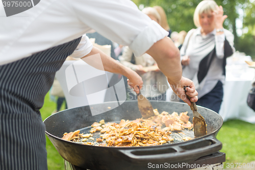 Image of Cheff preparing traditional Slovenian kaiserschmarrn .