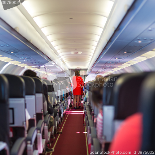 Image of Stewardess on the airplane.