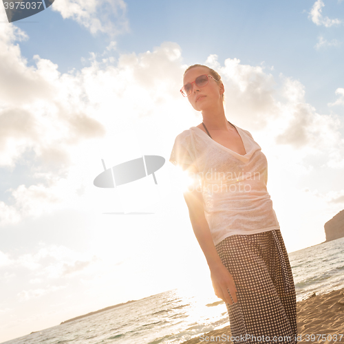 Image of Relaxed Happy Woman Enjoying Sun on Vacations.