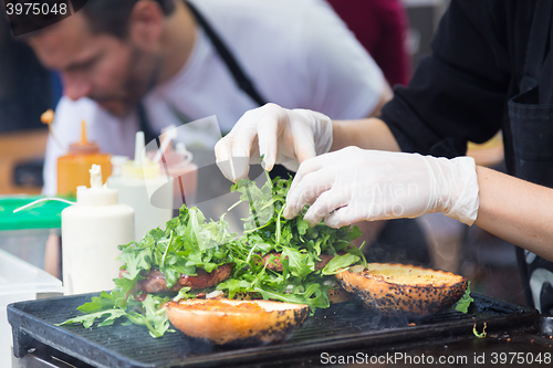 Image of Beef burgers ready to serve on food stall.