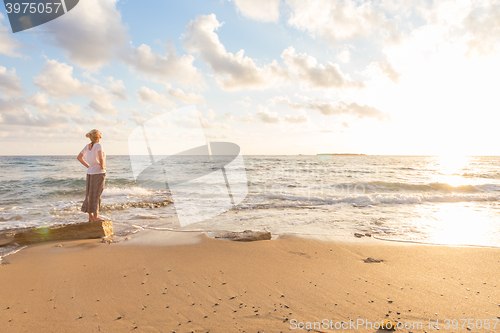 Image of Free Happy Woman Enjoying Sunset on Sandy Beach