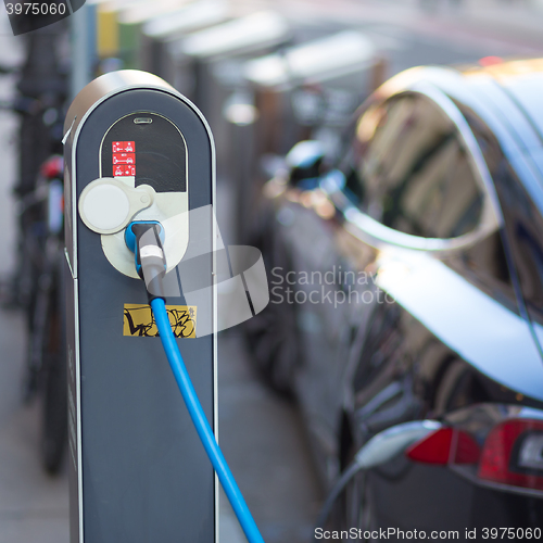 Image of Electric Car in Charging Station.