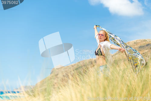 Image of Free Happy Woman Enjoying Sun on Vacations.