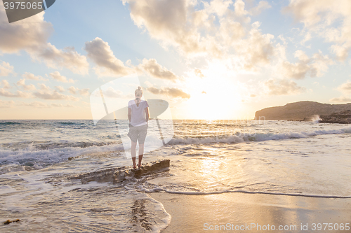 Image of Free Happy Woman Enjoying Sunset on Sandy Beach