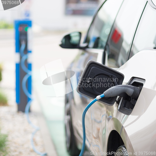 Image of Electric Car in Charging Station.