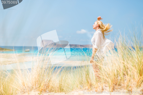 Image of Free Happy Woman Enjoying Sun on Vacations.