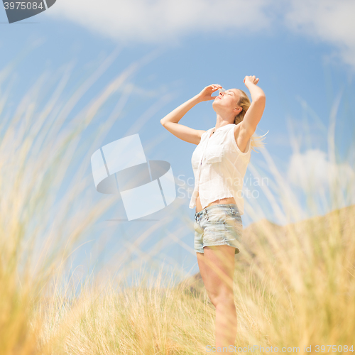 Image of Free Happy Woman Enjoying Sun on Vacations.