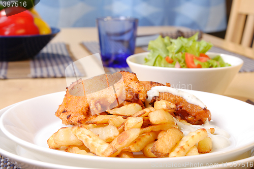 Image of French fries and chicken