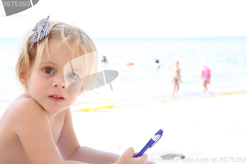 Image of Portrait of baby girl on the beach