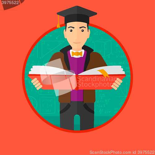 Image of Graduate with book in hands.
