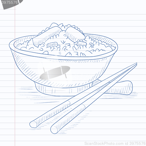 Image of Bowl of boiled rice with chopsticks.