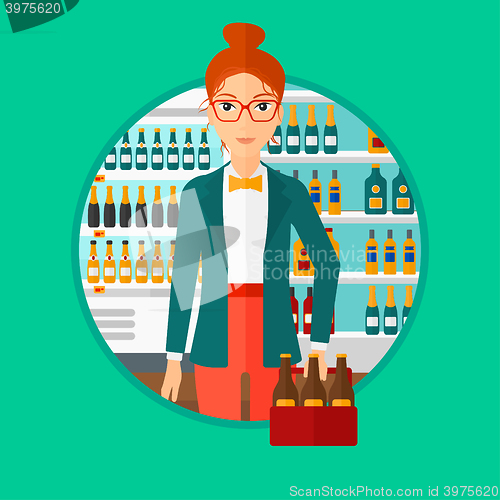 Image of Woman with pack of beer at supermarket.