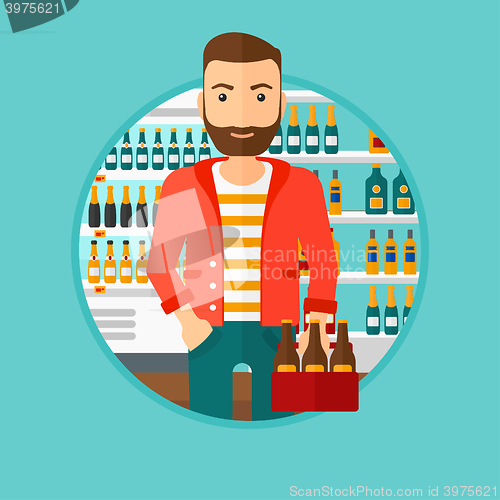 Image of Man with pack of beer at supermarket.