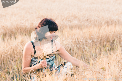Image of Middle aged beauty woman in barley field