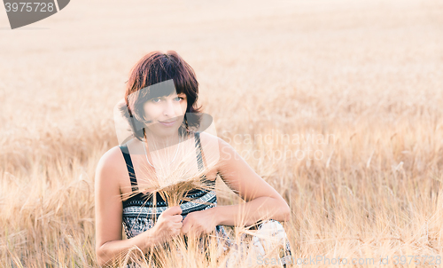 Image of Middle aged beauty woman in barley field