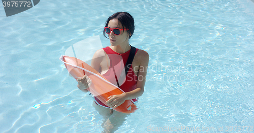 Image of Lifeguard walking through shallow water