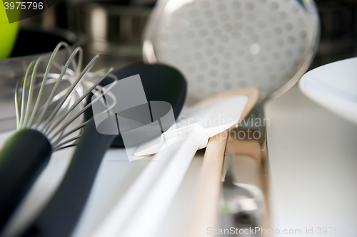 Image of Various tableware on shelf in the kitchen