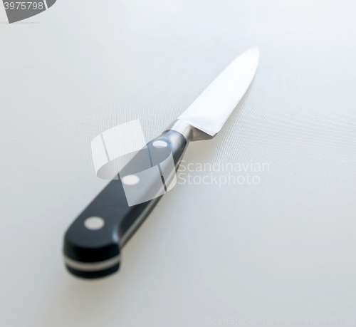 Image of Cutting board and kitchen knife