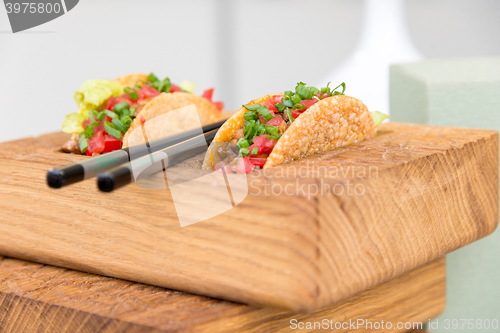 Image of fresh mexican taco shells with beef and vegetables