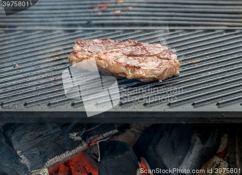 Image of beef steaks on the grill