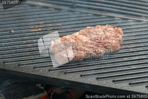 Image of beef steaks on the grill