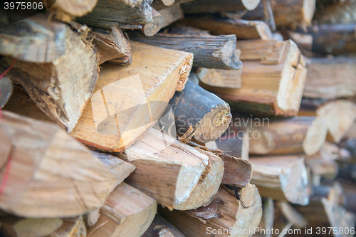 Image of dry chopped firewood logs in a pile