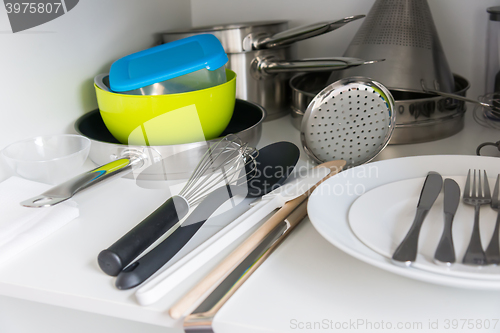 Image of Various tableware on shelf in the kitchen