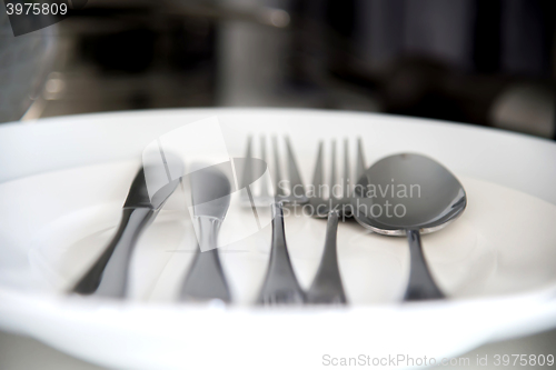 Image of Fork, Spoon and Table Knife on the white background