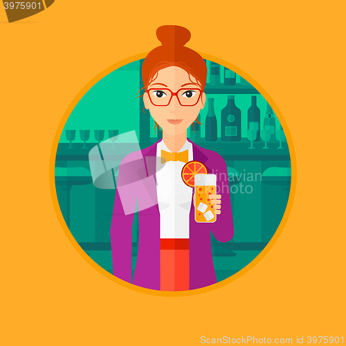 Image of Woman drinking orange cocktail at the bar.